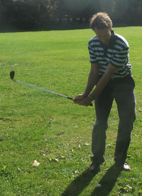 Alan Jones in golfing action